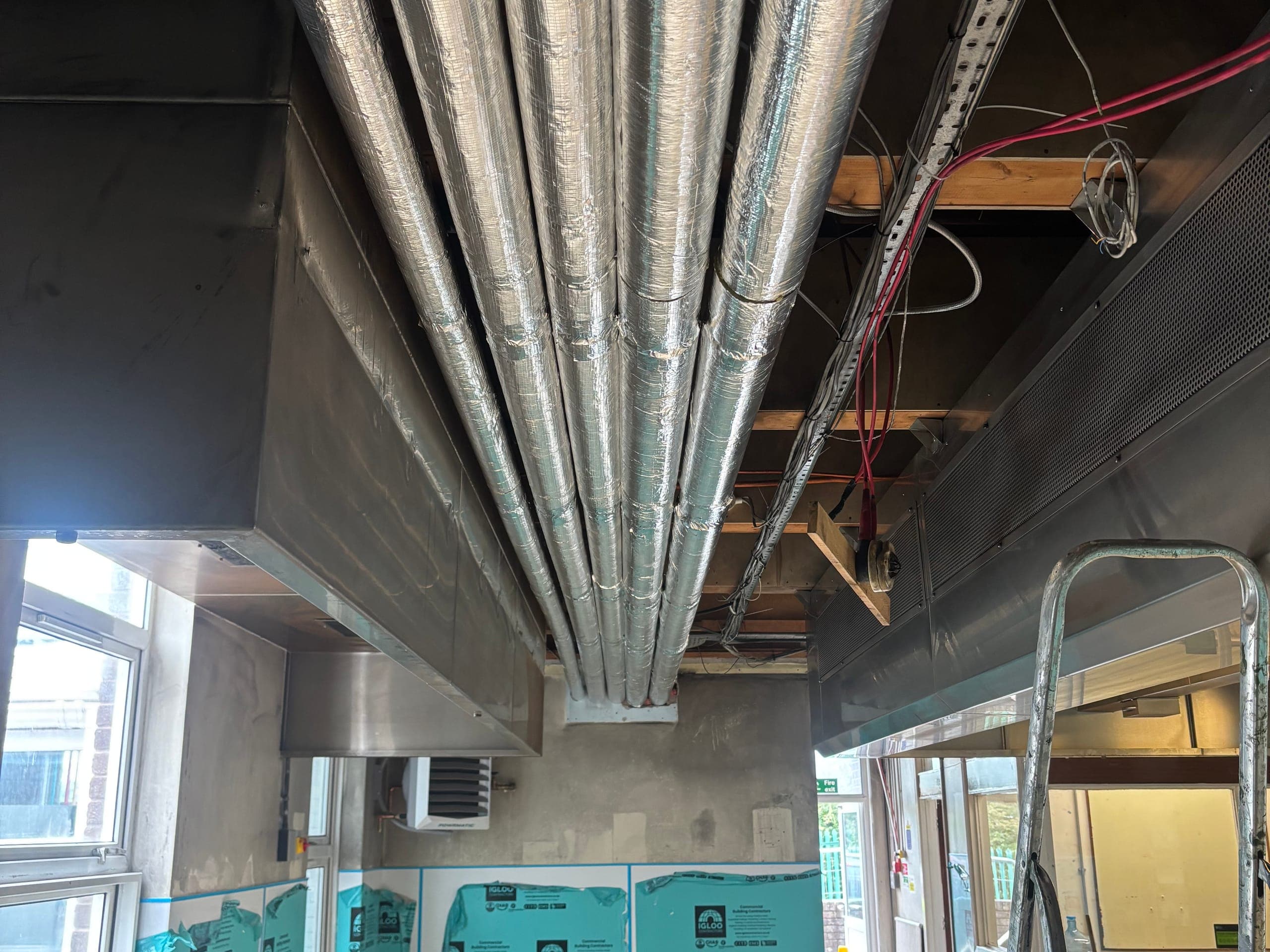 Insulated ductwork run in a ceiling void at Beckstone School