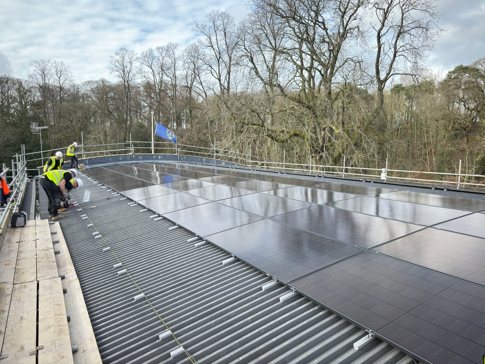 Roof-mounted solar PV panels running along the ridge