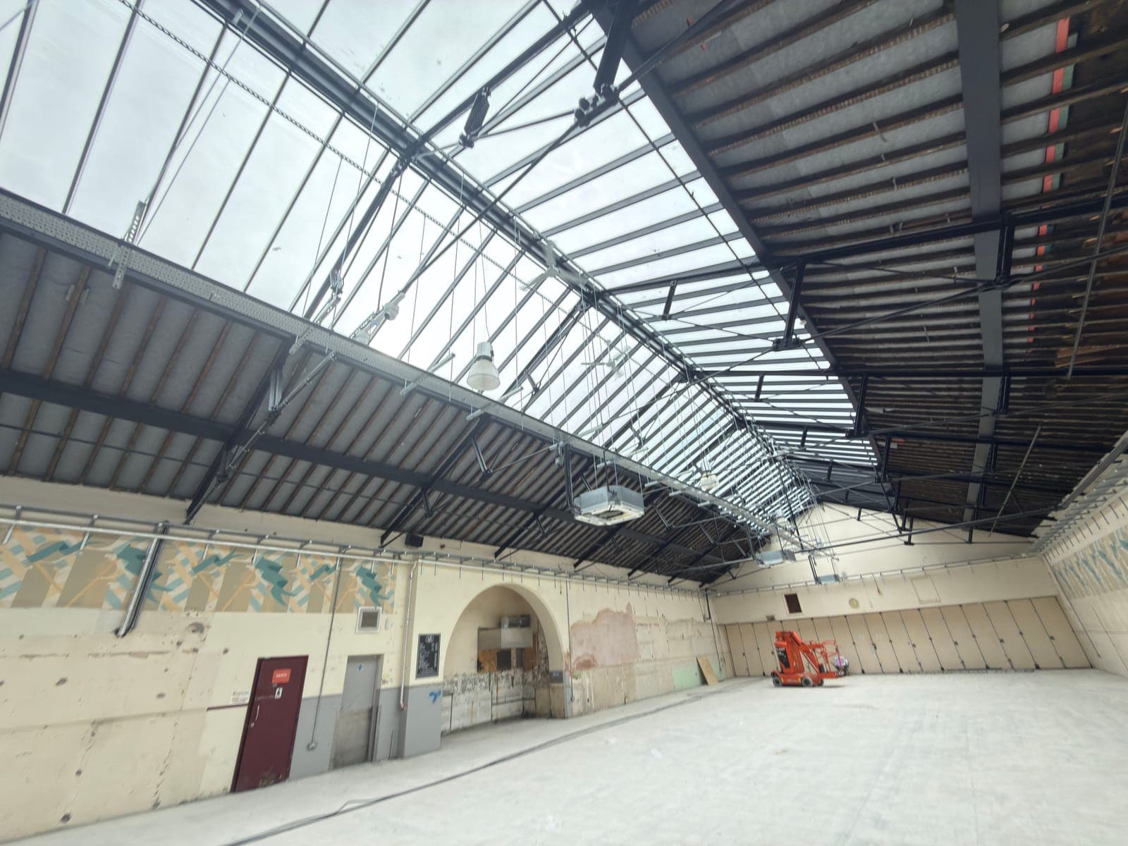 Market hall interior with the original arched doorway and decorative frieze