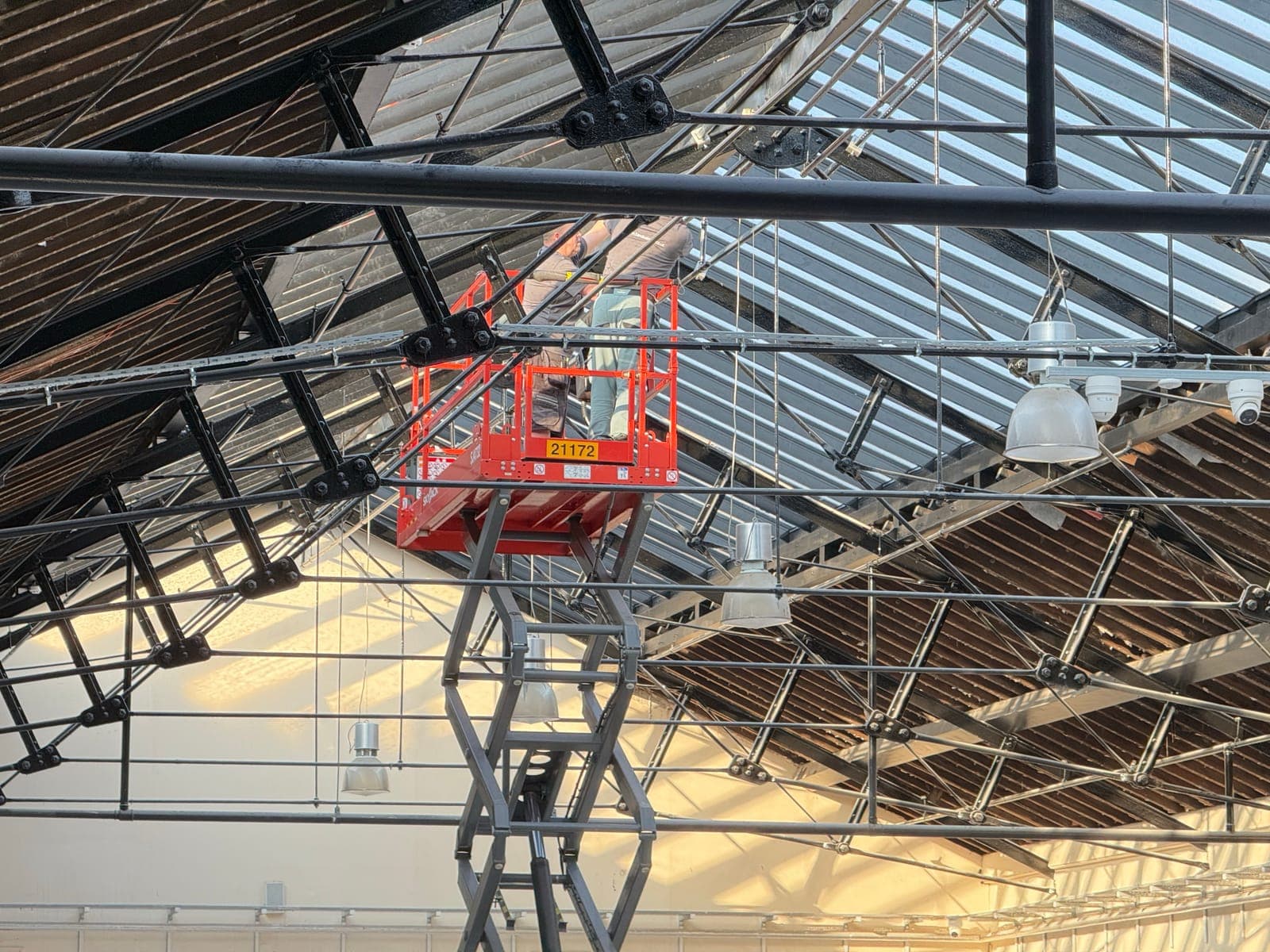 Access platform raised to roof level to reach the services runs