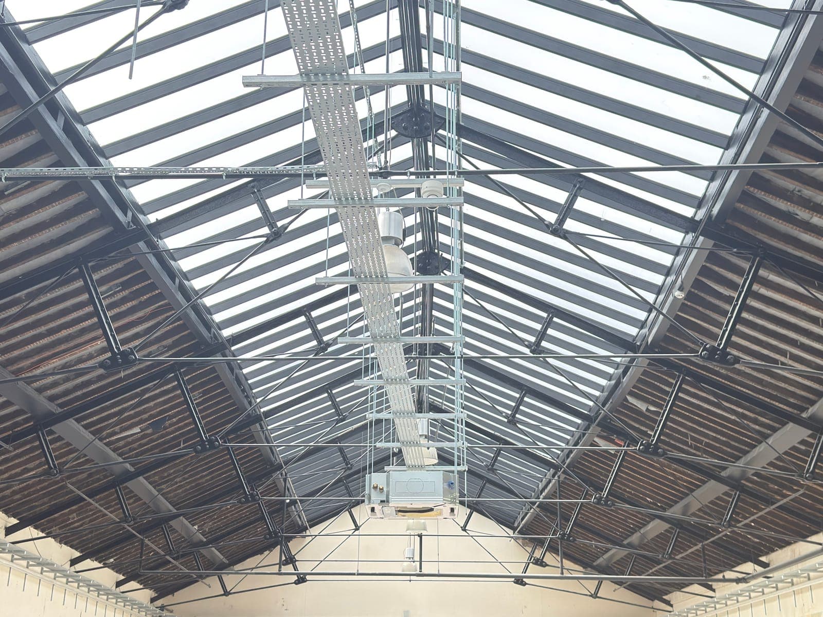 Steel roof trusses and glazed roof lights above the market hall