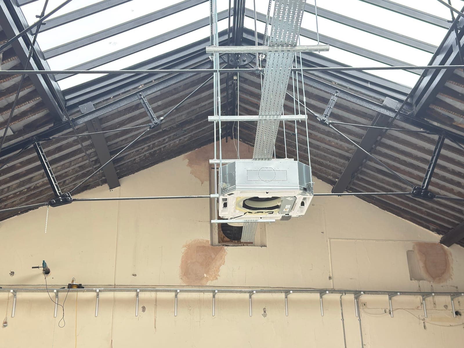 Ceiling-mounted air handling unit installed at high level