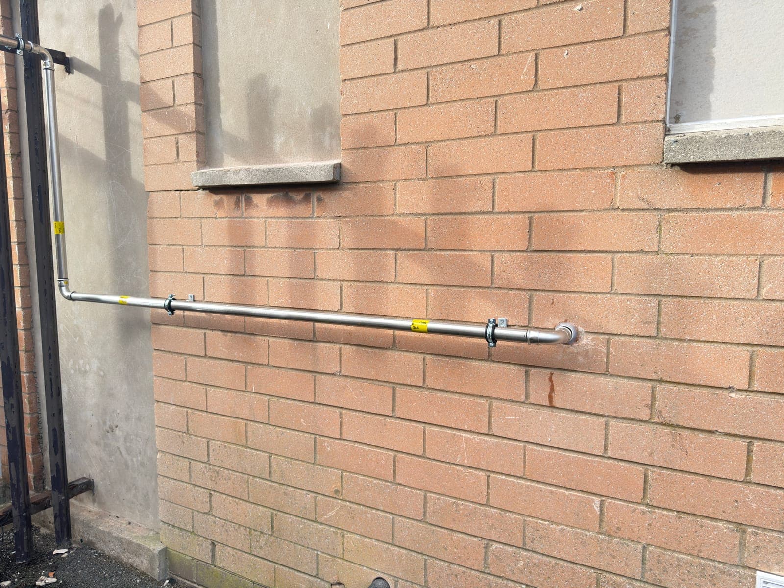 External gas pipework run along the building