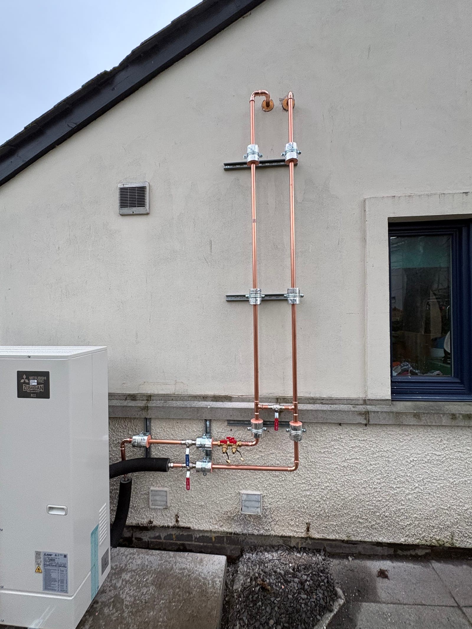 Heat pump and pipework outside the care home